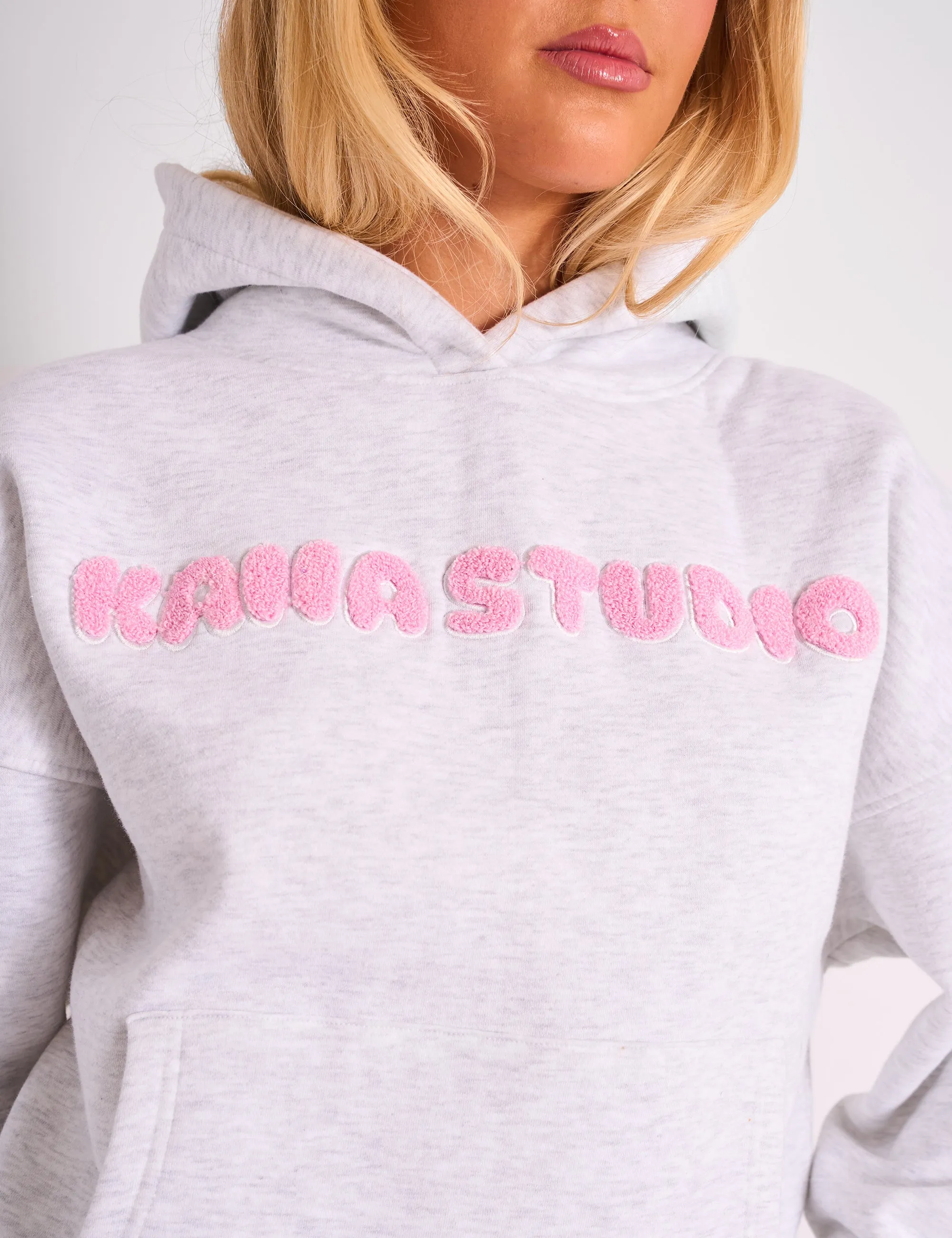 Sure! Heres an optimized title for the e-commerce product:

Kaiia Studio Oversized Bubble Logo Hoodie in Grey Marl & Pink - Trendy and Comfortable Sweatshirt for a Casual Look