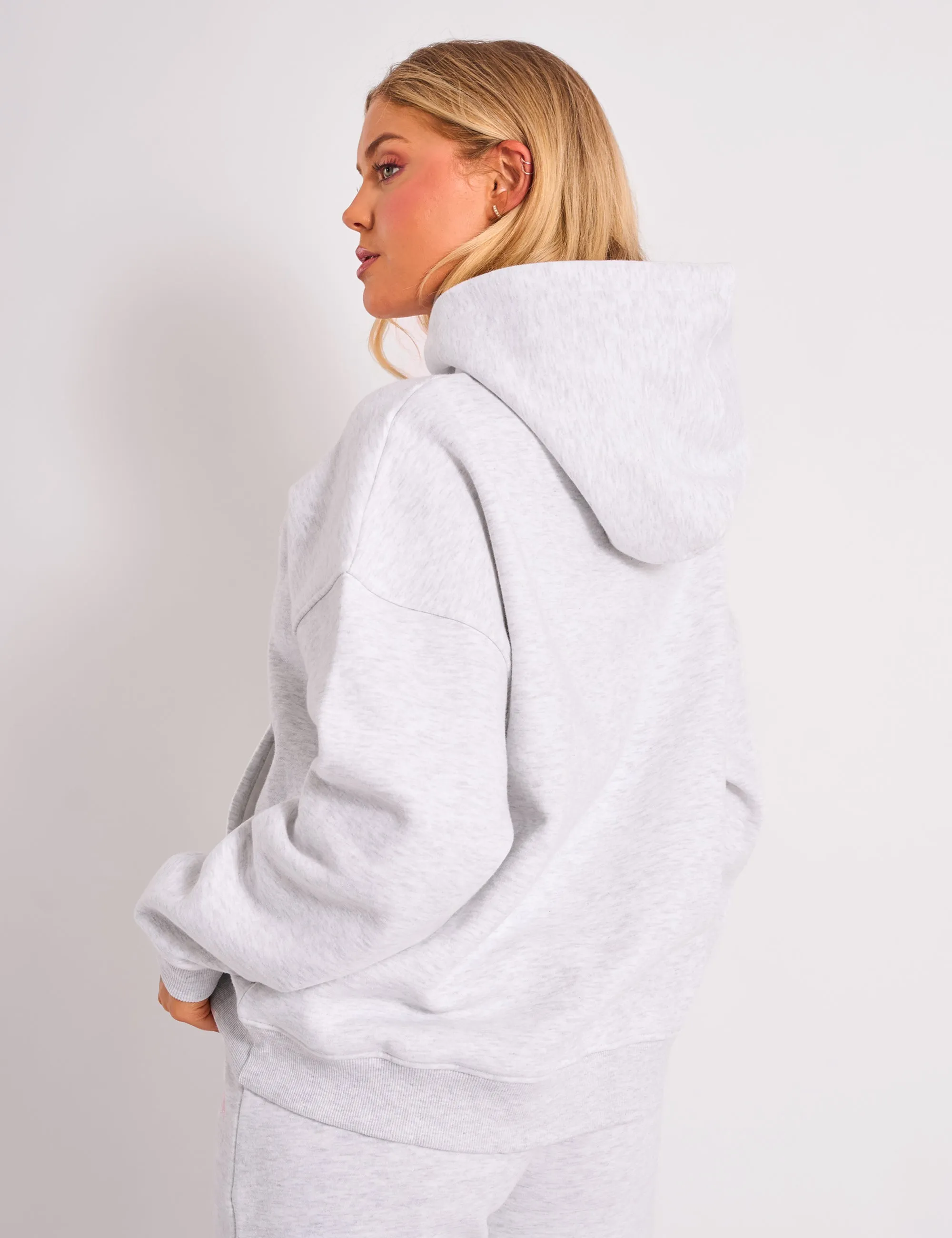 Sure! Heres an optimized title for the e-commerce product:

Kaiia Studio Oversized Bubble Logo Hoodie in Grey Marl & Pink - Trendy and Comfortable Sweatshirt for a Casual Look