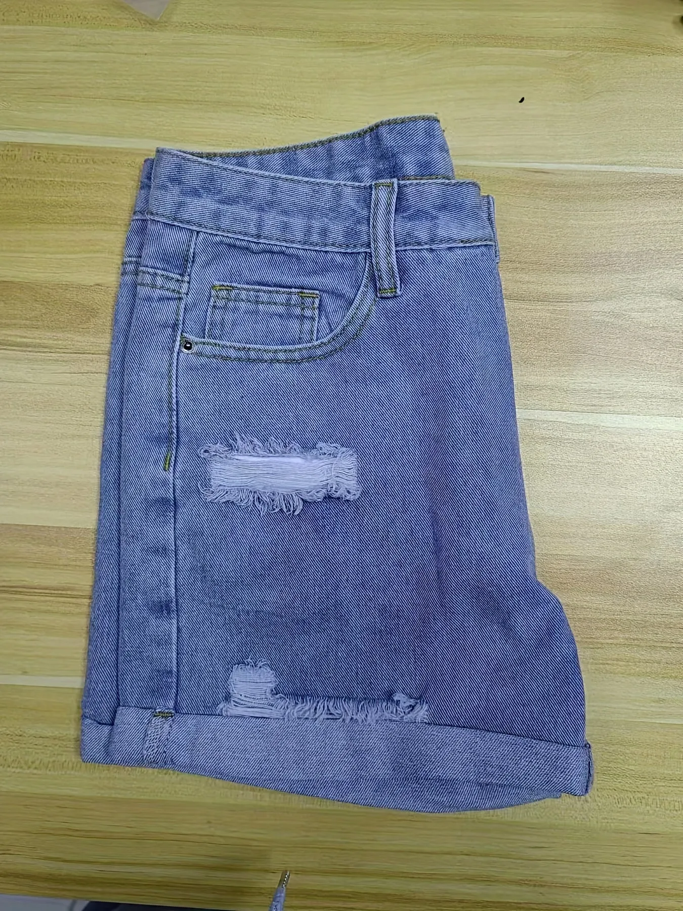 Trendy Blue Denim Shorts with Chic Ripped Details & Rolled Hem - Durable, Casual Wear for Fashion-Forward Women